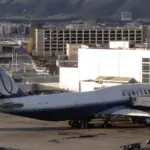 Traveler meeting a private car driver with luggage at San Francisco airport